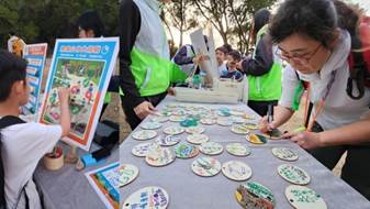 A group of people writing on a table
AI-generated content may be incorrect.